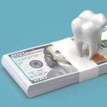 A tooth model over a stack of cash
