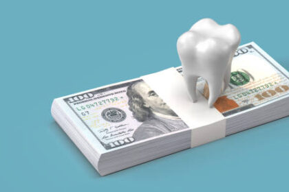 A tooth model over a stack of cash