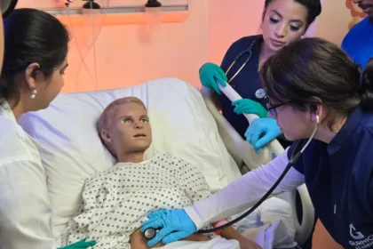 Vocational nursing LVN program students practicing on a patient simulator