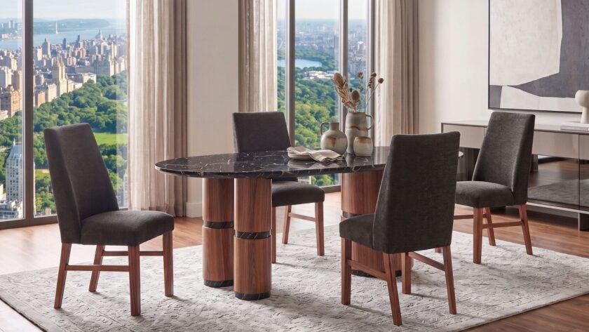 Wholesale dining room furniture set with an oval black and gold faux marble table and dark upholstered chairs